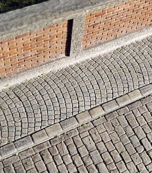 Straight footpath with arched paving