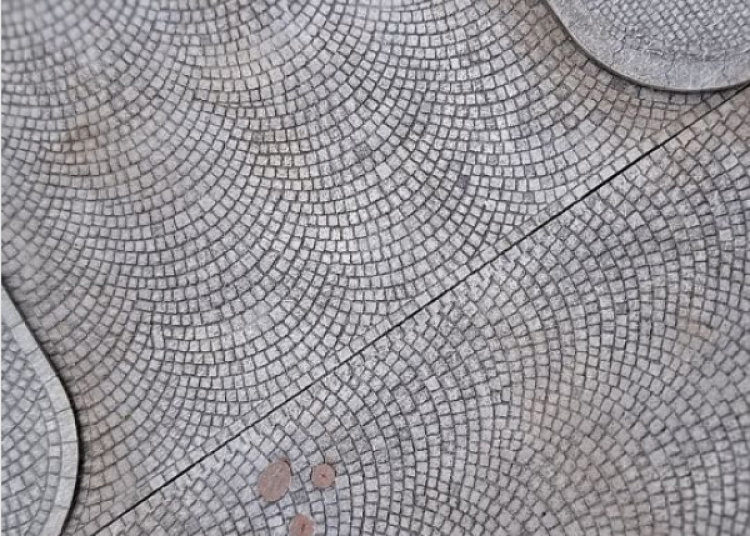 Arched-pattern paved road T-junction